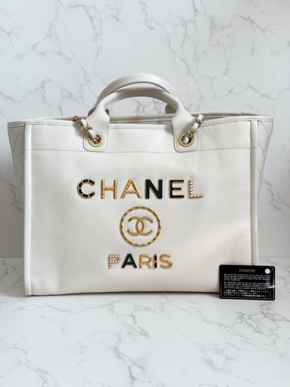 CHANEL White Leather Logo Tote with Gold & Black Accents